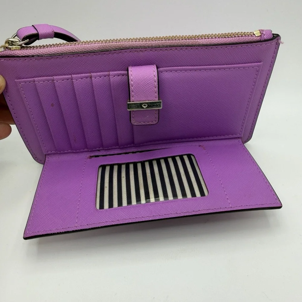 Kate Spade New York purple leather wristlet.